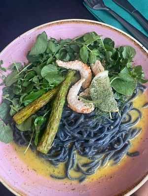 Caspian Sea. Charcoal activated Taglioni served with a dill hollandaise sauce and topped with Shrimpz at Pastan Bristol in Bristol