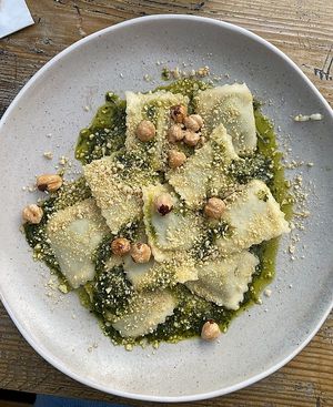 Green velvet pasta. Pea and shallot ravioli dressed with salsa verde and cashew parmesan.  at Pastan Bristol in Bristol