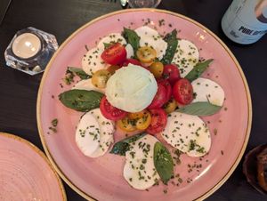 Vegan mozzarella salad (starter) with avocado ice cream at Pastan Bristol in Bristol