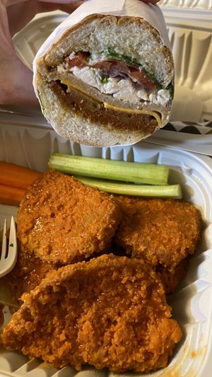 Italian sandwich (added bacon) w/Buffalo wings  at Subculture Vegan Deli & Provisions  in Albany