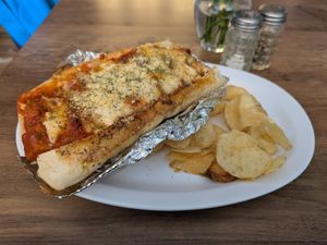 Seitan chicken parm with default side of chips at Subculture Vegan Deli & Provisions  in Albany