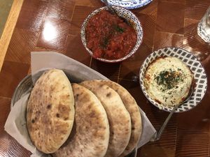 The fluffiest pita with spicy tahini and madbukha  at Mazal in Los Angeles