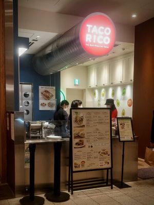 This is it -- the ingredient bar and a couple of tiny tables in front of it, right next to a super busy aisle at Taco Rico - Midtown in Tokyo