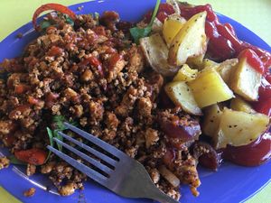 Tofu scramble over spinach with potatoes - yum! at Deep Roots Market in Greensboro