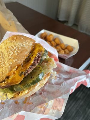 Classical burger with Big Machine toppings and taters 🤤🔥 at Green Machine Grill in Colorado Springs
