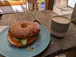 Bagel with fresh mango and avocado and a small cappuccino at Cafe Hinterzimmer in Freiburg