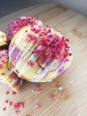 Zingberry Martini: Lemon and raspberry vodka cookies stuffed with a lemon/raspberry vodka curd. Drizzled with lemon glaze and sprinkled with freeze dried raspberries. at Angel's Sinfully Delicious Cookie Company in Long Eaton