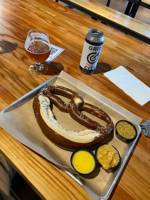 Vegan pretzel with vegan sauces (cheese, butter, and mustard). at Grid City Beer Works in Salt Lake City