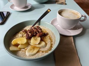 Porridge and Latte with oatmilk  at Kinder Kitchen in South East London
