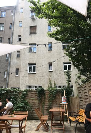 Outside seating in a calm inner court yard  at Artelier Cafe & Bar in Bratislava