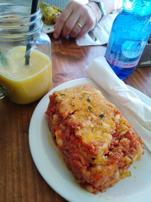 traditional maltese baked rice is with a tomato sauce and cheese on top. plus mango and passionfruit smoothie which was just average out of a bottle. at Cafe Castille in Valletta