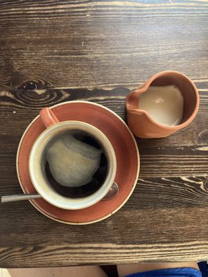 Coffee with jug of soy milk  at Black Cat Café in Gozo