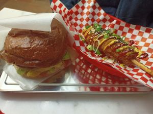 Burger of the month and corn dog at Kitsune Burgers in Brussels