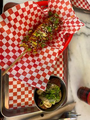 Corn dog and kimchi rice balls at Kitsune Burgers in Brussels