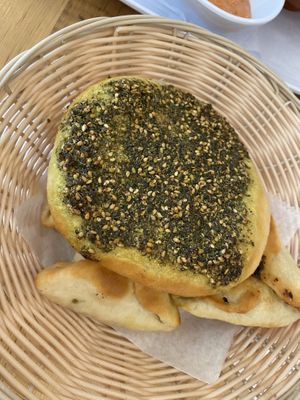 Zaatar pie on top and Jordanian pies with spinach on the bottom at Jordan Pie Cafe in New York City