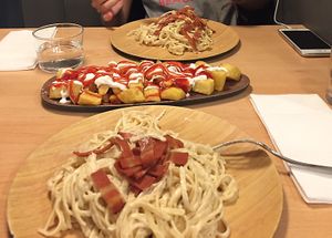 Pasta carbonara & patatas bravas at A Flama in Zaragoza