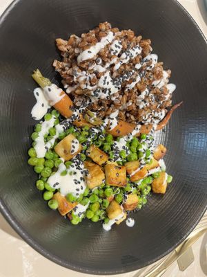 Tempeh and rice bowl in an orange dressing   at Linfa in Milan