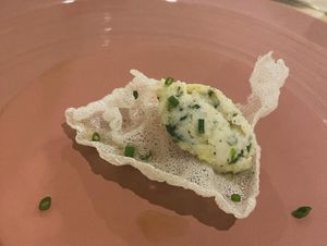 Feb 2024: Taster from the chef - cracker with vegan cod fish and Sicilian lemon. Amazing!   at Linfa in Milan