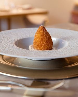 Arancin* made with cashews, almonds and Sicilian pistachio pesto  at Linfa in Milan