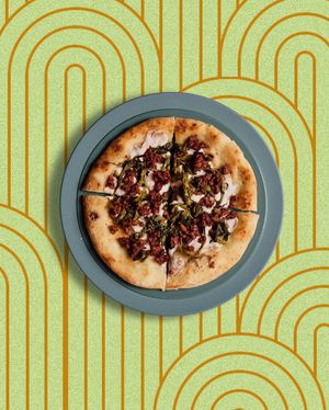 Gluten-free pizza with fennel sausage, friarielli and vegetable scamorza made with cashews and almonds at Linfa in Milan