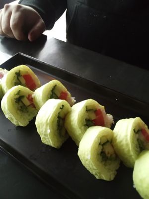 Grinch Roll vegan tuna, avocado, asparagus, cucumber wrapped in green soy paper  at Sakana in Rocky River