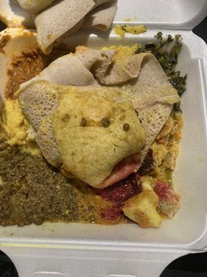 I made the bread look like that so i could take a pic of all the food underneath   at Almaz Cafe in Philadelphia