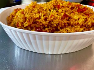 Delicious, Spicy jollof rice has a sweet pepper & organic Roma tomato base with caramelized onions and African spices to wake up your taste buds at Halisi Africa in Tallahassee
