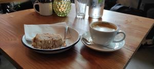 Decaf cappuccino and a half eaten Pear cinnamon cake at Lisa's Deli in Zwolle