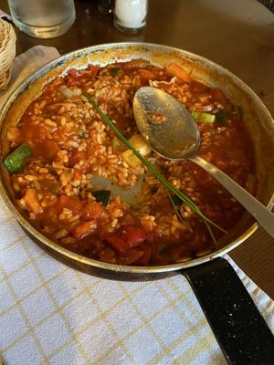 The remaining risotto after I’d served my portion. (That spoon is a huge serving spoon size not a regular spoon!) at Oštarija Peglez'n in Bled
