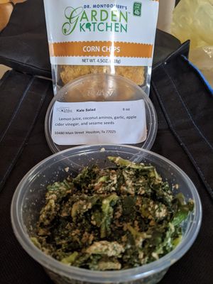 Creamy crunchy kale salad with housemate raw corn chips. Heart healthy deliciousness! at The Garden Kitchen in Houston