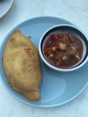 Empanada with salsa. at Rozey in Delft