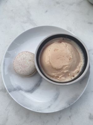 A macaron with blood orange ice cream. at Rozey in Delft