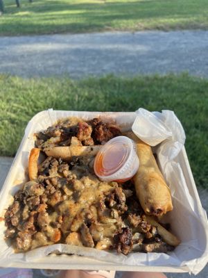 The sampler - vegan philly cheesesteak slider, egg roll and loaded fries  at Philly Vegan in Richmond