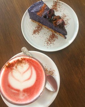 Afternoon treat 💜 pink beetroot late and blueberry cheesecake  at Ahimsa in Mallorca