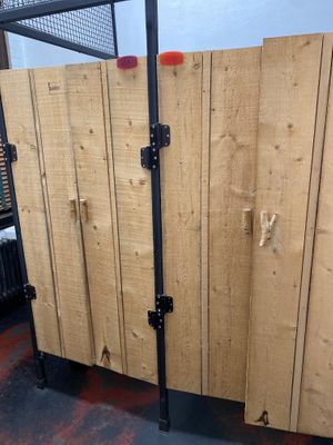 Quirky wooden stalls in the women’s bathroom.  at The Little Grille in Littleton