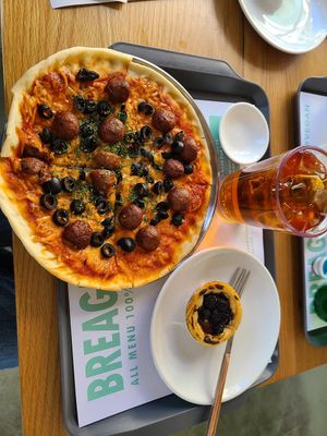 Pizza with meatballs and black olives, blueberry tart at Breaghetti Itaewon in Seoul