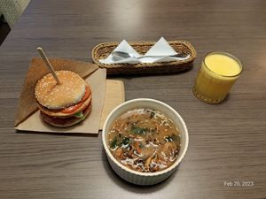 Vegan burger, tom yam soup and Fresh juice. at Veggie Bar in Minsk