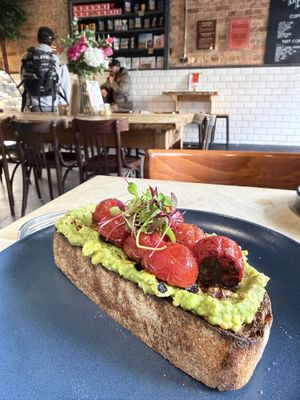 Avocado toast with cherry tomatoess  at South Coast in Bournemouth