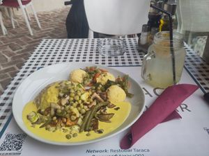 Creamy spicy vegan curry and lemon ginger juice at Resto Bar Taraca in Kotor