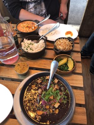 We split the vegan stroganoff (orange in back of photo) and vegan feijoada (black in front of photo) both were so delicious but the feijoada had my heart   at Berimbau Brazilian Kitchen in New York City