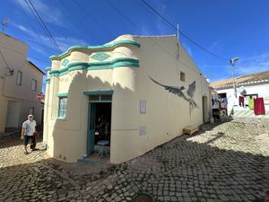 Lovely street art bird on the side   at Andorinha do Mar in Budens