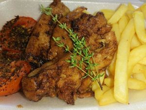 Vegan BBQ Chops with grilled tomatoes and chips. at Buttercup in Durban