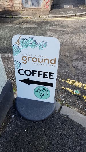 Sign at the corner. at Ground Plant Based Coffee in Swansea