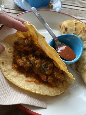 View inside vegan tacos: a soy meat and tomato sauce, some veggies, and don’t miss the Spanish pimento sauce that looks like ketchup but tastes!!! at La Hormiga in Pontevedra