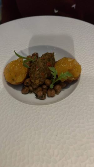 Garbanzo beans with akra topped with a chutney   at Grey Sweater in Oklahoma City
