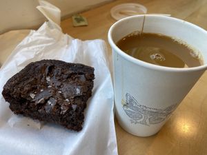 Drip coffee with oat milk and vegan brownie at Forage Coffee Company in Medford