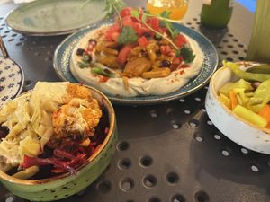 hummus shawarma, with pickled sides  at Bliski Wschód in Warsaw