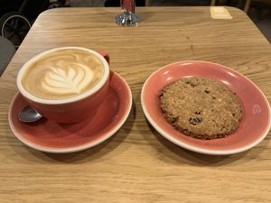 Cappuccino with oat milk and vegan cookie  at Coffeedesk Kawiarnia in Warsaw