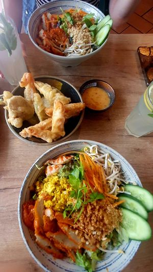 Bowls with mycket meat and rice noodles and tempura at La Vegana in Warsaw