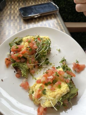 Avocado toast with egg    at Kindbelly Cafe in Myrtle Beach